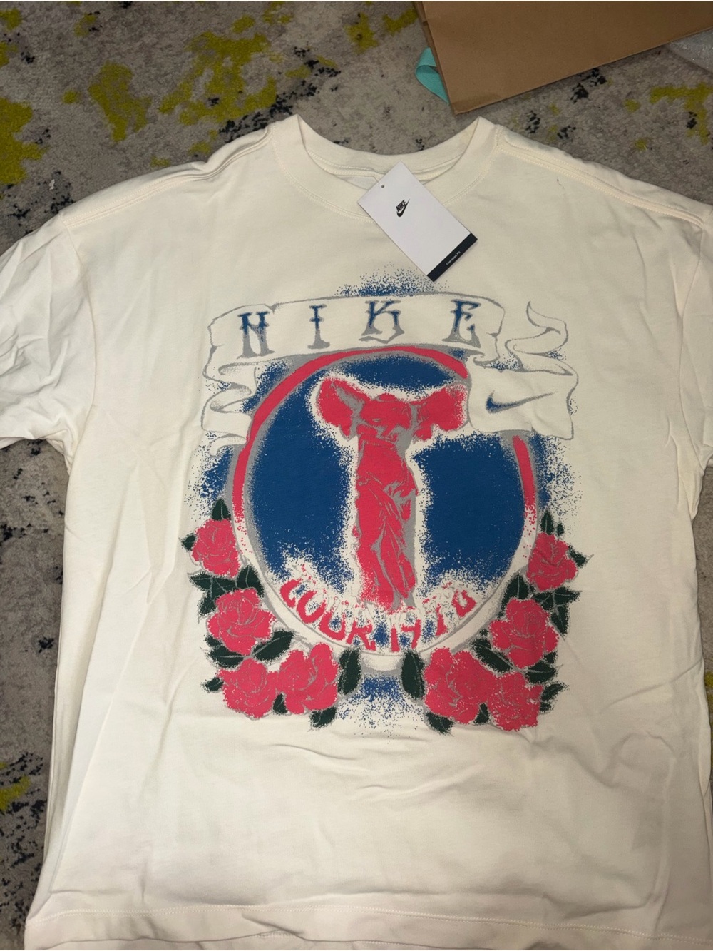 Nike Cream Short-Sleeve Graphic Tee with Blue & Pink Print